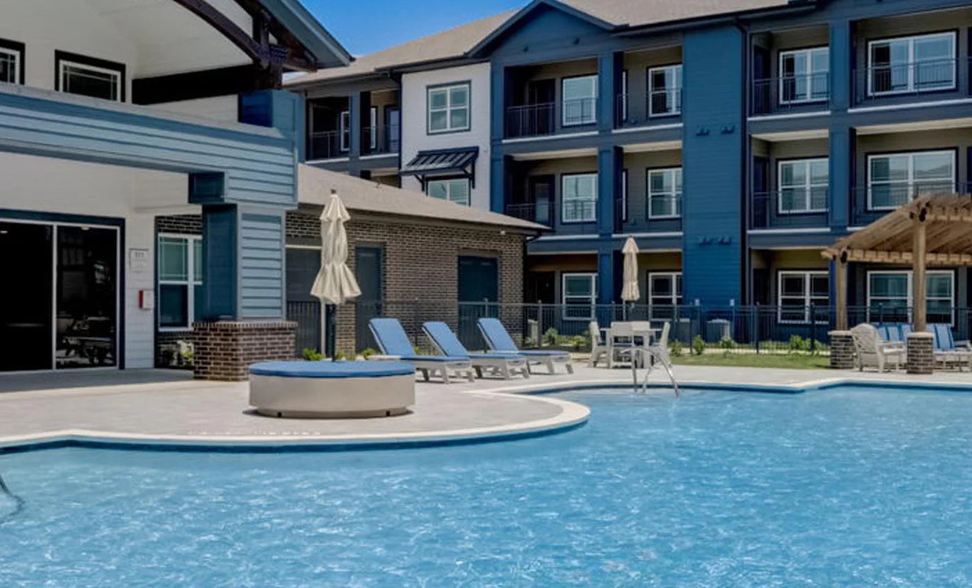 Signature Round Sunbed With White Cushions.