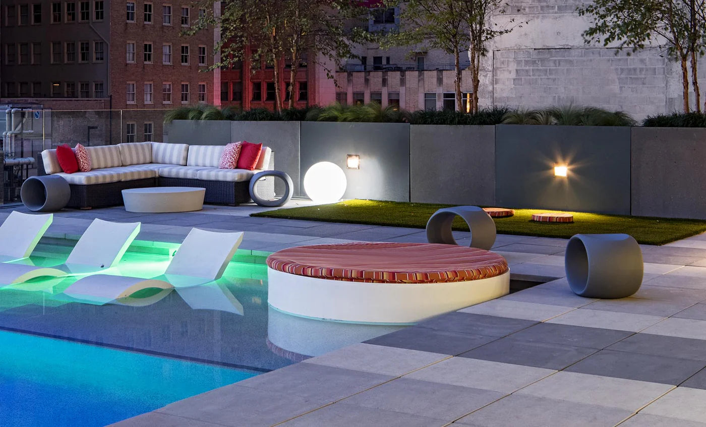 Signature Round Sunbed With White Cushions.